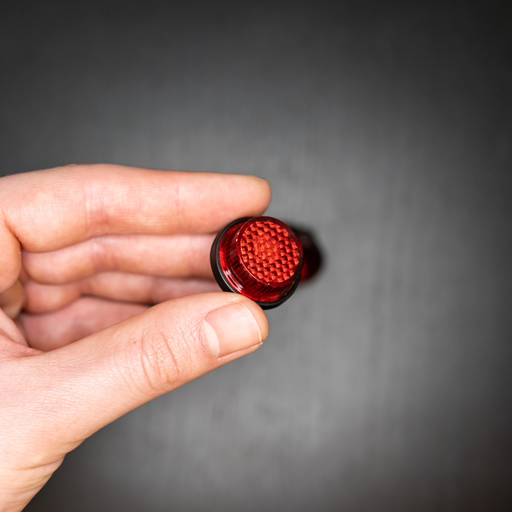 RED MOTORCYCLE MINI LICENSE PLATE REFLECTOR BOLTS Close up